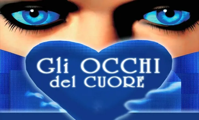 Due grandi occhi azzurri sopra un cuore blu con la scritta Gli Occhi del Cuore